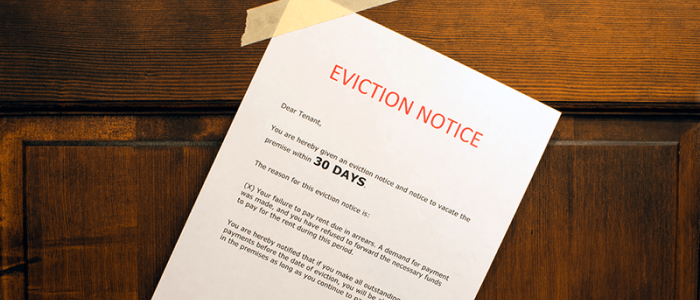 An eviction notice taped to a door.